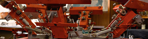 silk screen textile printery banner. print screening apparatus. serigraph printing production stock photo