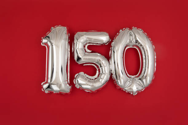 Silver 150 balloons on wine red matt background stock photo