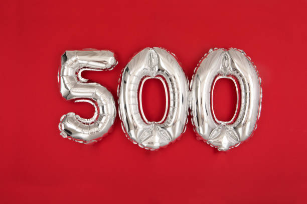 Silver balloon showing number 500 on red background stock photo