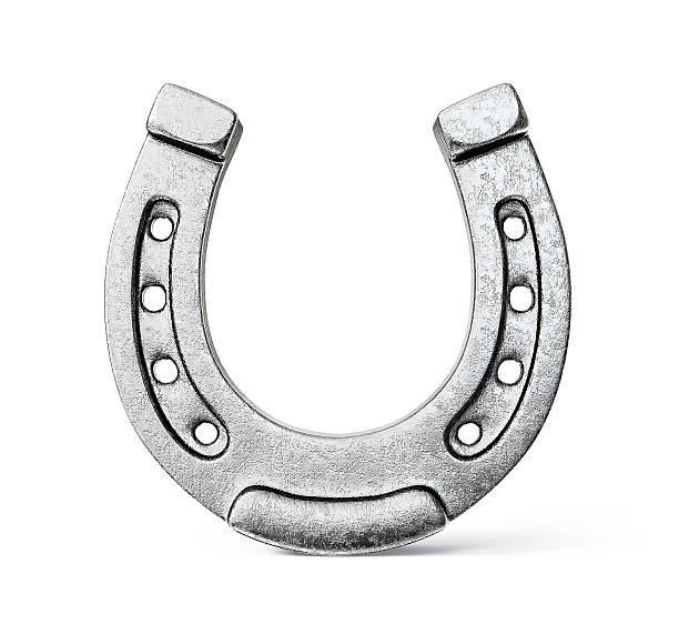 Silver colored horseshoe on a white background metal horseshoe isolated on a white background horseshoe stock pictures, royalty-free photos & images