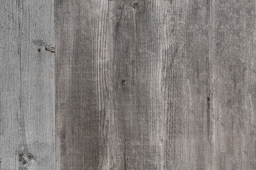 silver grey wood background texture with weathered rustic look in barn