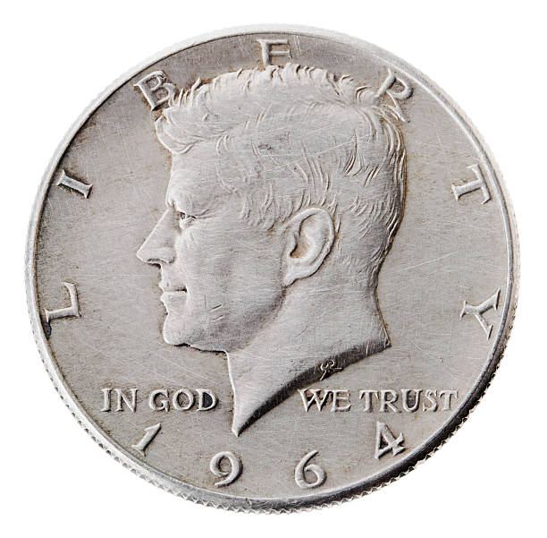 Silver Kennedy Half Dollar - Heads Frontal Frontal view of the obverse (heads) side of a silver half Dollar minted in 1964. Depicted is a profile portrait of John F. Kennedy and comes to honor his memory.  1964 stock pictures, royalty-free photos & images