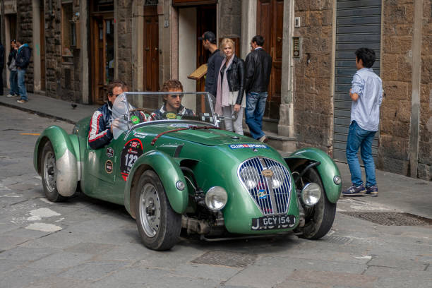Florence, Italy - May 7, 2010: HEALEY Silverstone (1949) in the rally Mille Miglia 2010 edition on a busy street in Florence. stock photo