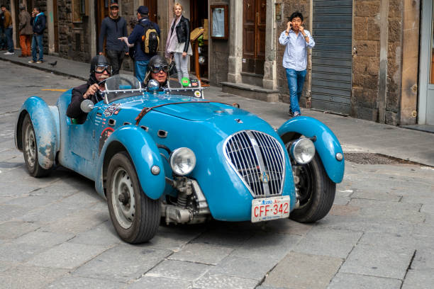 Florence, Italy - May 7, 2010: HEALEY Silverstone (1949) in the rally Mille Miglia 2010 edition on a busy street in Florence. stock photo