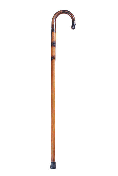 Simple brown and black wooden cane on a white background  stock photo