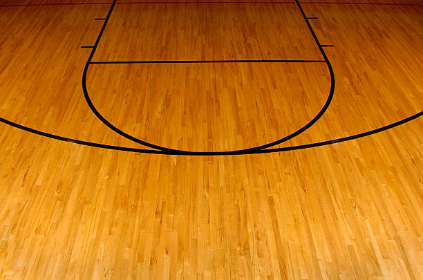 Simplistic aerial view of a basketball court Wooden basketball floor with the foul and three point line. basketball court stock pictures, royalty-free photos & images