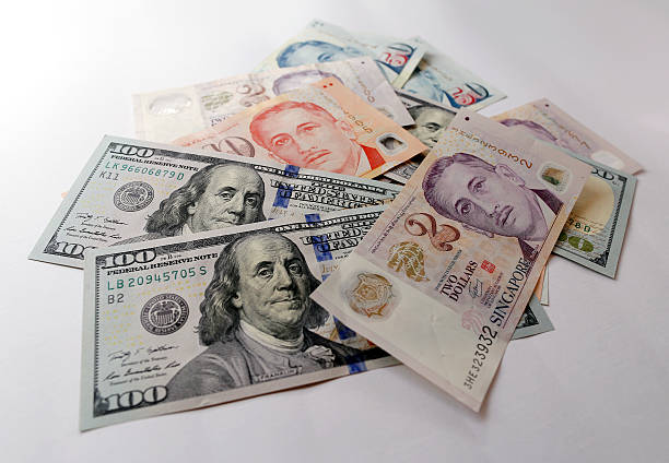 Singapore and US Dollar isolated on white background stock photo