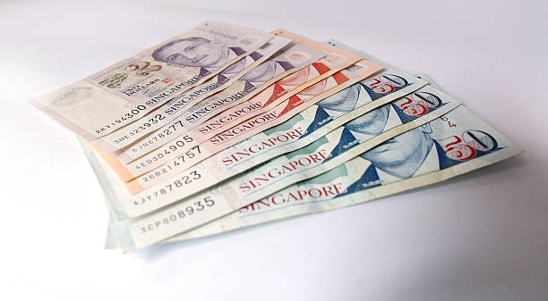 Singapore Dollar on white background stock photo