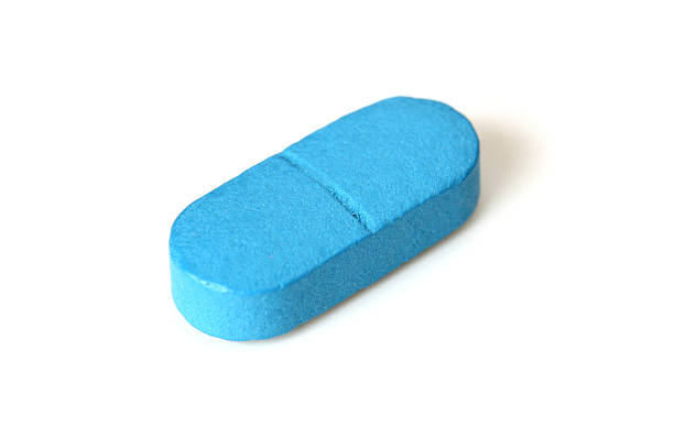 Single blue tablet or pill  anti impotence tablet stock pictures, royalty-free photos & images