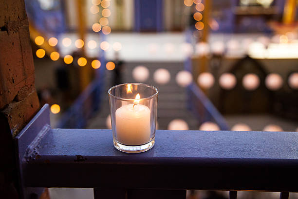 Single Candle on Banister stock photo