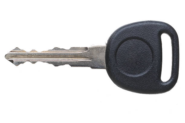 A single car key on a white background stock photo