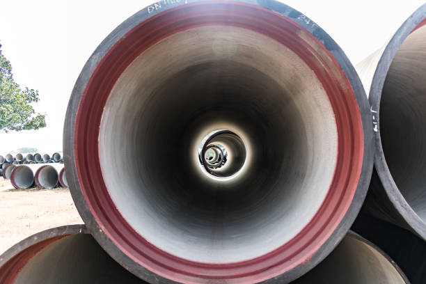 single ductile iron pipe stored in open space store yard. stock photo