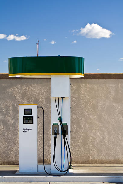 single green and white hydrogen fuel pump on a sunny day - green hydrogen bildbanksfoton och bilder