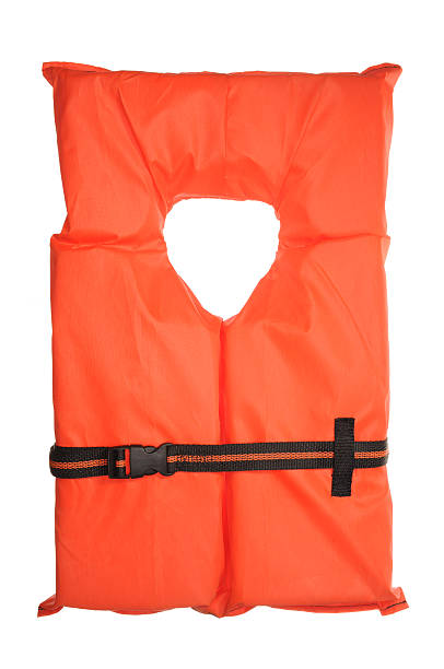 A single orange life vest on a white background stock photo