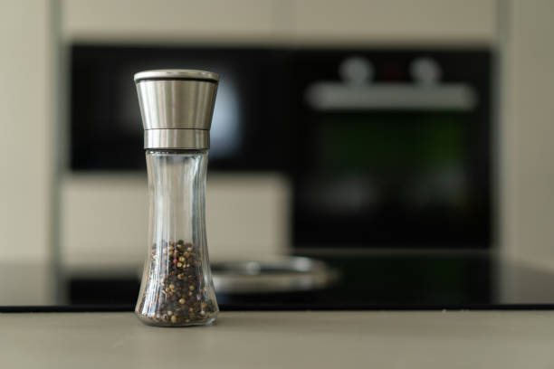 single pepper mill in kitchen stock photo