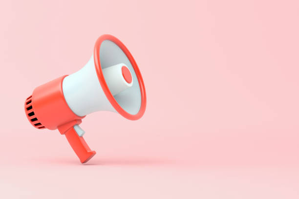 Single red and white electric megaphone with a handle stands on a pink background 3d illustration alertness stock pictures, royalty-free photos & images
