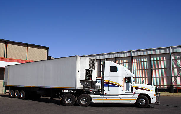 Single semi truck at a distribution goods warehouse stock photo