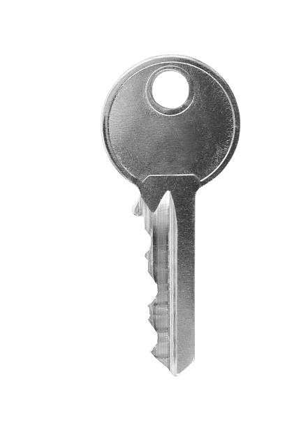 Single silver key on a white background stock photo