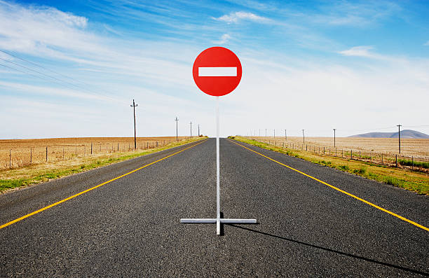 A single street sign on a desolate road  dead end road stock pictures, royalty-free photos & images