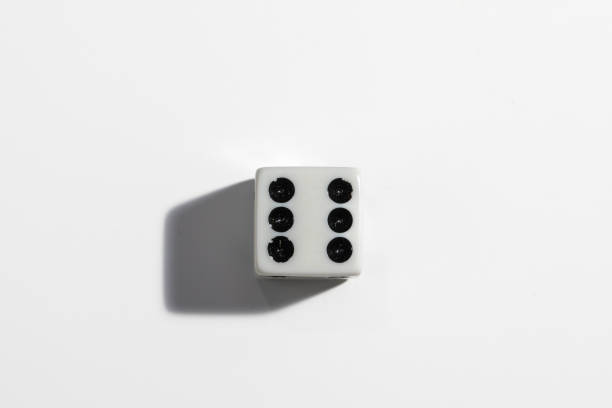 Single white dice with a six on a white background. Win or lose. Catch your luck. Gambling equipment. stock photo