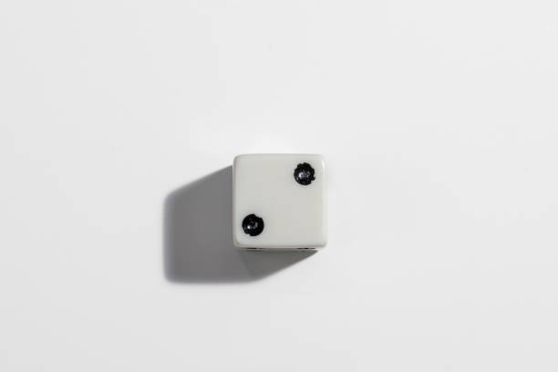 Single white dice with a two on a white background. Win or lose. Catch your luck. Gambling equipment. stock photo