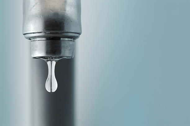sink faucet dripping with the water drop in focus - tap water bildbanksfoton och bilder