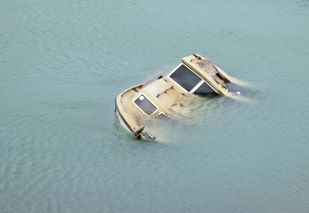 Sinking boat stock photo