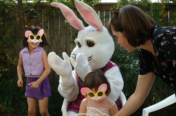 Sisters Posing with the easter Bunny  easter sunday stock pictures, royalty-free photos & images