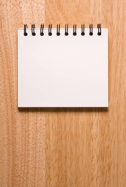 Sketchbook on wood background stock photo