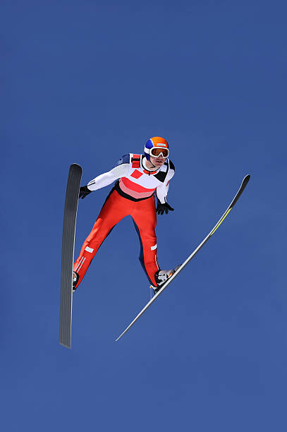 Ski jumper flying stock photo