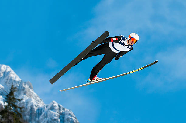 Ski jumper in mid-air stock photo