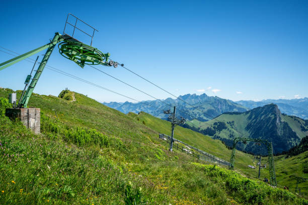 Ski lift during summertime and view of Swiss Alps in Switzerland Ski lift during summertime and view of Swiss Alps in Switzerland t bar ski lift stock pictures, royalty-free photos & images