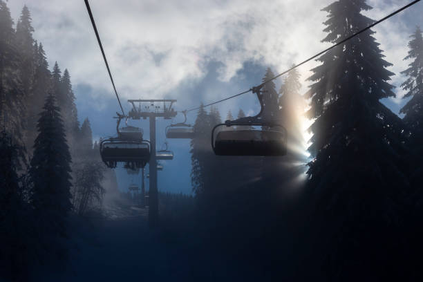 Ski lift in the fog stock photo