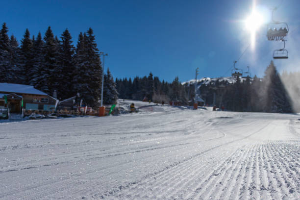 Ski slope and ski lift stock photo