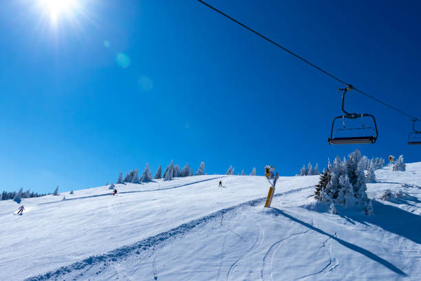 Ski slope and ski lift stock photo