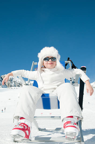 Young skier in winter resort