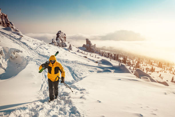 skier goes uphill in ski tour - kemerovo imagens e fotografias de stock