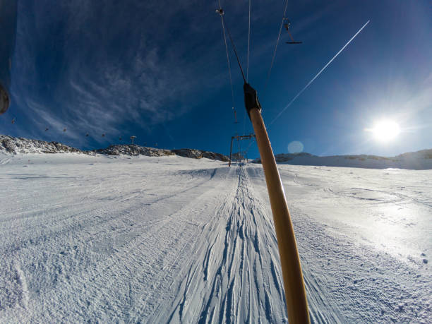 POV of skier on ski lift POV of skier on ski lift t bar ski lift stock pictures, royalty-free photos & images