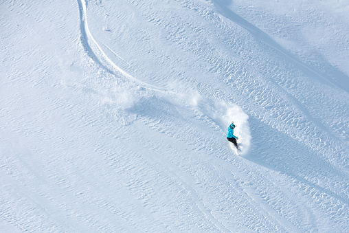 Skier skiing off-piste on a beatiful mountain slope