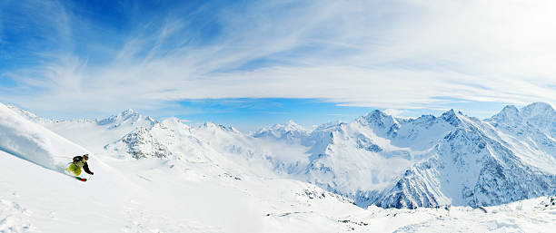 Skiing in powder snow stock photo