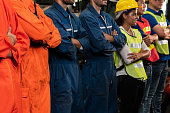 istock Skillful worker stand together showing teamwork in the factory . 1300607363