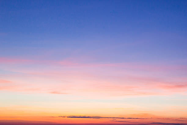sky blue to orange sunset - zonsondergang stockfoto's en -beelden