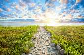 istock Sky clouds, sunlight and path, beauty nature background 1327151708