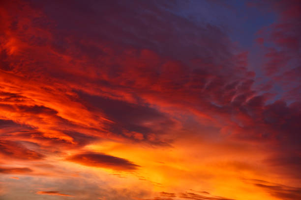 sky in colors of fire horizontal nature background of sky in fire colors, red, orange, yellow. atmospheric mood photos stock pictures, royalty-free photos & images
