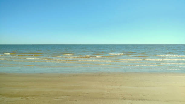 Sky, Waves, and Sand at El Jardin Beach stock photo