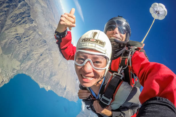 Skydiving on Queenstown in New Zealand. stock photo