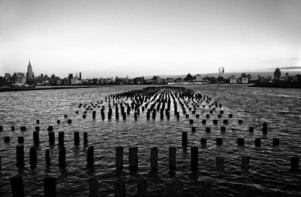 NYC skyline and wooden pillars stock photo