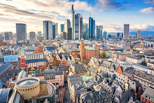 Stock photograph of the skyline of downtown Frankfurt am Main Germany with the old town in the foreground on a sunny day.