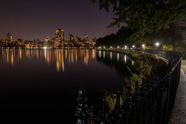 Skyline of downtown Manhattan by night stock photo