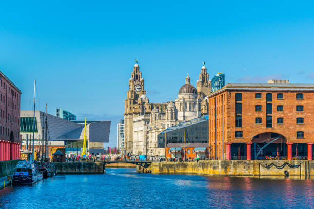Skyline of Liverpool through albert dock, England Skyline of Liverpool through albert dock, England cunard building liverpool stock pictures, royalty-free photos & images